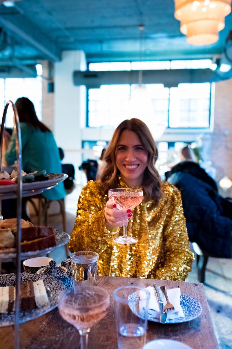 Anna Roufos Sosa of Noir Friday having the holiday afternoon tae at Soho House Chicago in a MSGM top.