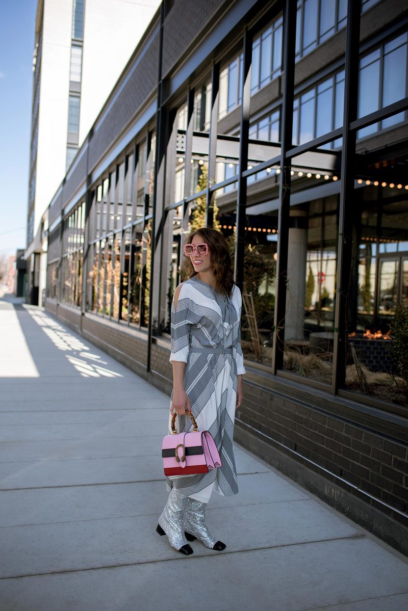 Anna Roufos Sosa of Noir Friday wearing a 10 Crosby Derek Lam dress, Chanel boots and a Gucci bag.