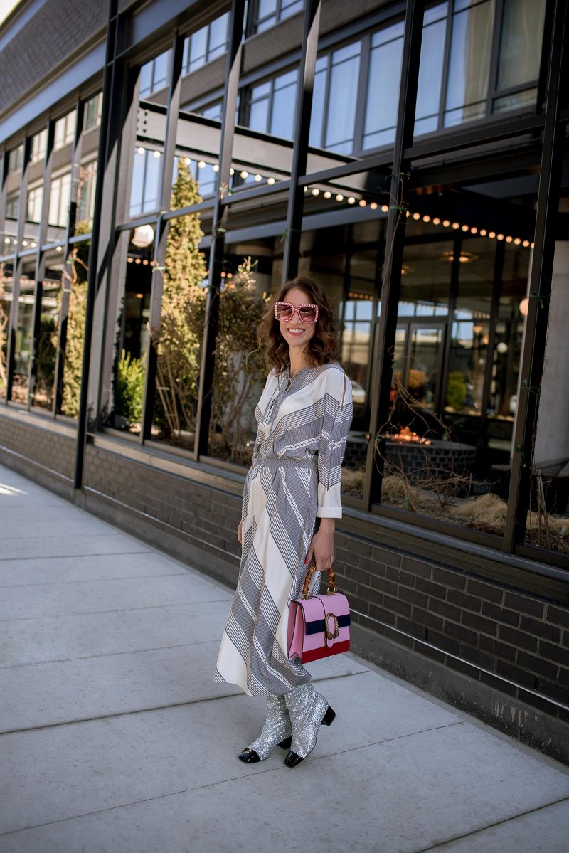 Anna Roufos Sosa of Noir Friday wearing a 10 Crosby Derek Lam dress, Chanel boots and a Gucci bag.