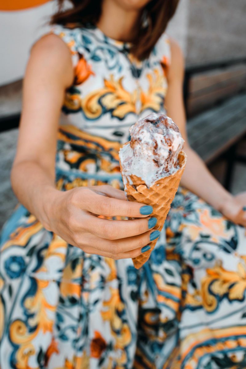 Anna Roufos Sosa of Noir Friday in a Dolce & Gabbana dress and shoes at Jenis's ice cream in Chicago.