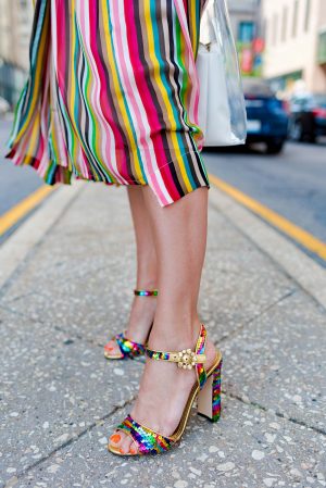 Anna Roufos Sosa of Noir Friday wearing a No. 21 dress, Dolce & Gabbana sandals and a Staud bag.
