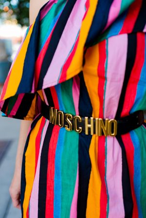 Anna Roufos Sosa of Noir Friday wearing a Who What Wear dress and Moschino belt.